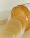 Close-up of Skin1004 Madagascar Centella Quick Calming Pad – Triple-layered crescent-shaped pad soaked with calming essence.