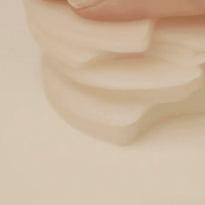 Close-up of Skin1004 Madagascar Centella Quick Calming Pad – Triple-layered crescent-shaped pad soaked with calming essence.
