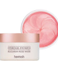 Heimish Bulgarian Rose Hydrogel Eye Patch applied to the under-eye area, brightening and hydrating tired, stressed skin
