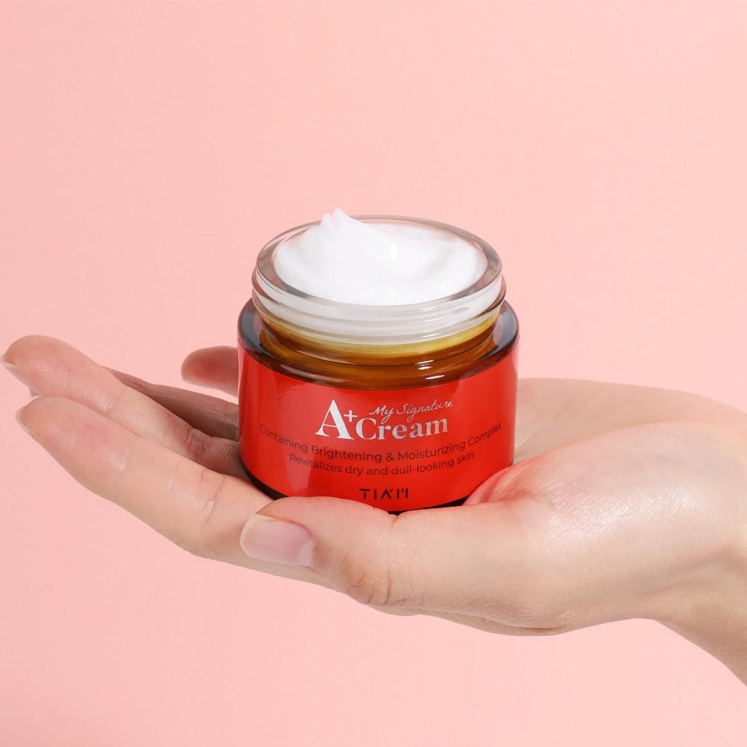 TIA'M My Signature A+ Cream – Close-up of the cream’s texture, showcasing its light and smooth consistency, ideal for moisturizing and firming the skin while reducing acne scars and evening out skin tone.
